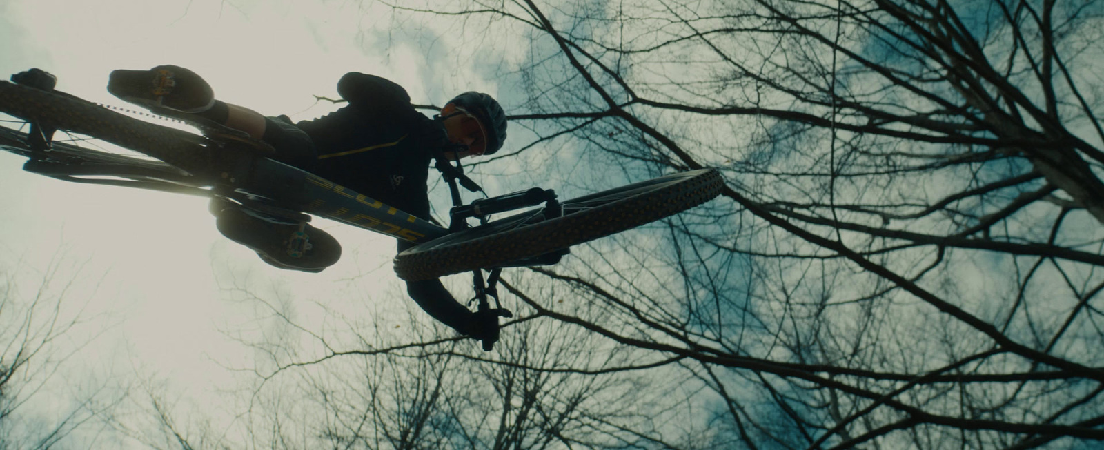 a man riding a snowboard through the air