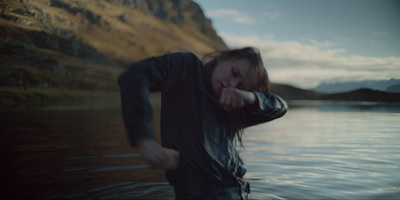 a woman standing in a body of water