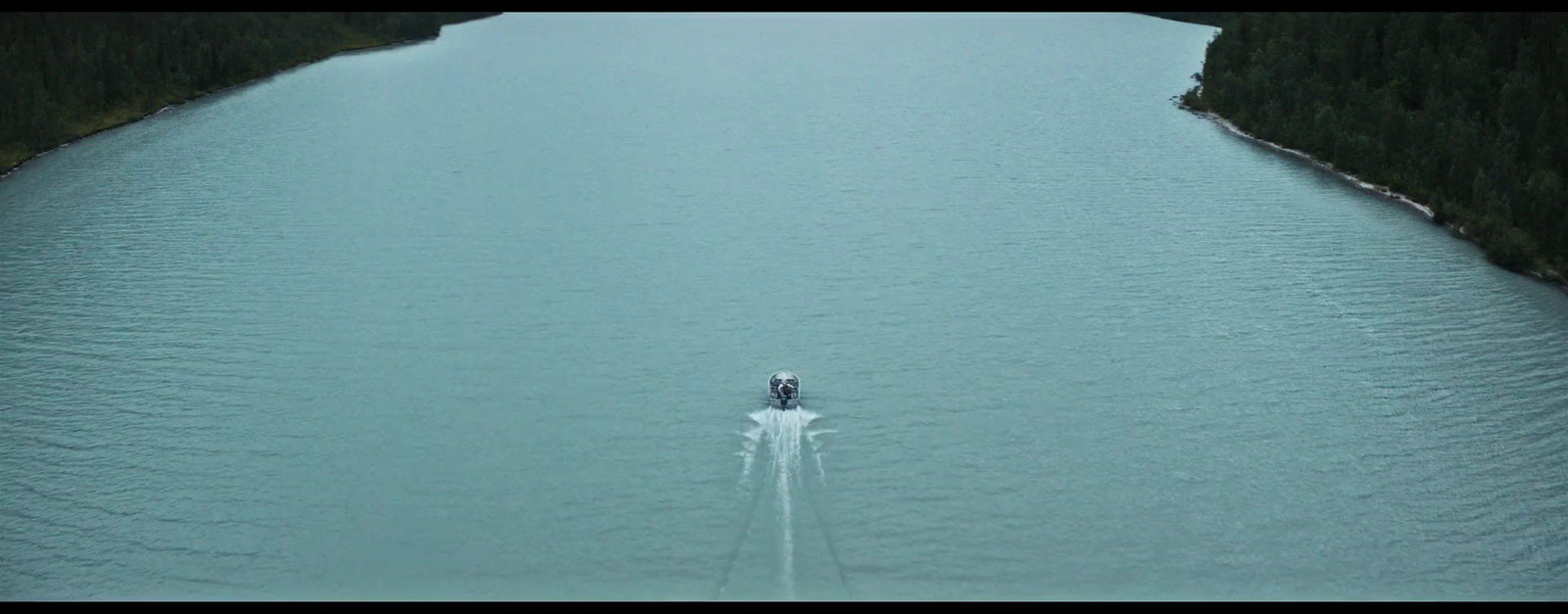 a boat traveling across a large body of water