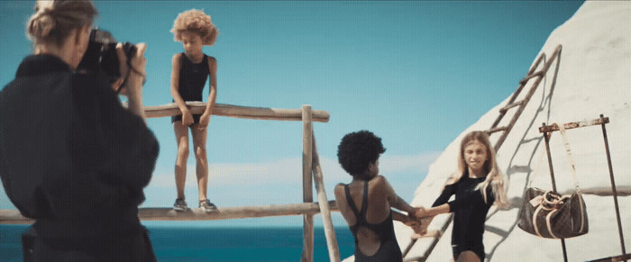 a group of people standing on top of a boat