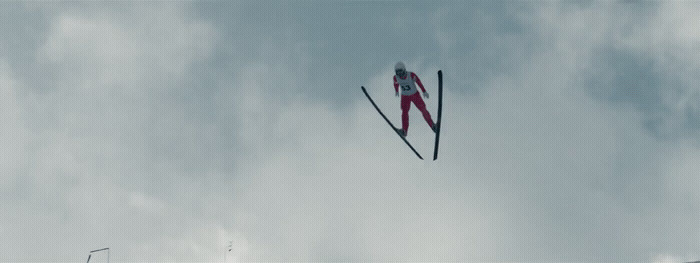 a pair of skis flying through the air