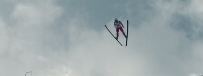 a pair of skis flying through the air