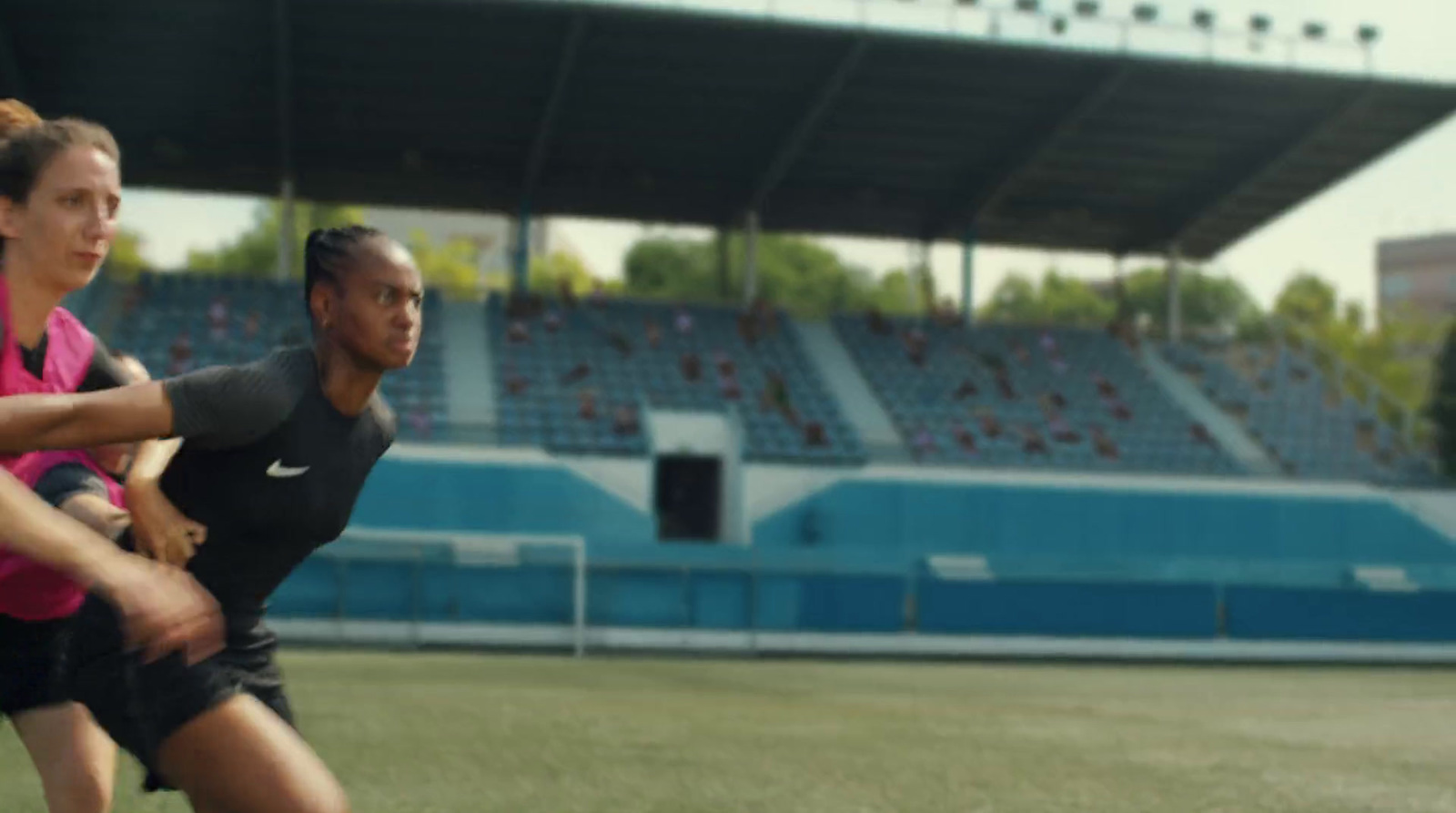 a couple of women playing a game of frisbee