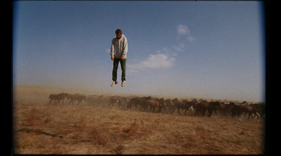 a man flying through the air while riding a horse