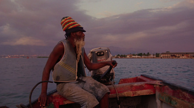 a man with a long beard sitting on a boat