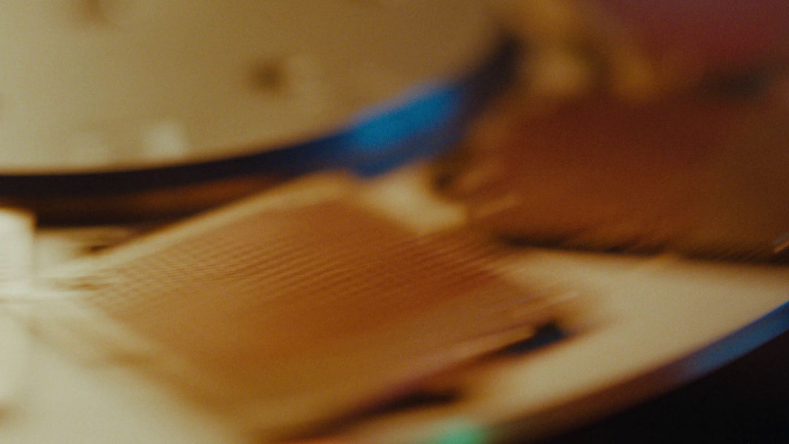 a blurry photo of a clock and a keyboard