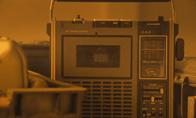 a radio sitting on top of a table next to a toaster oven