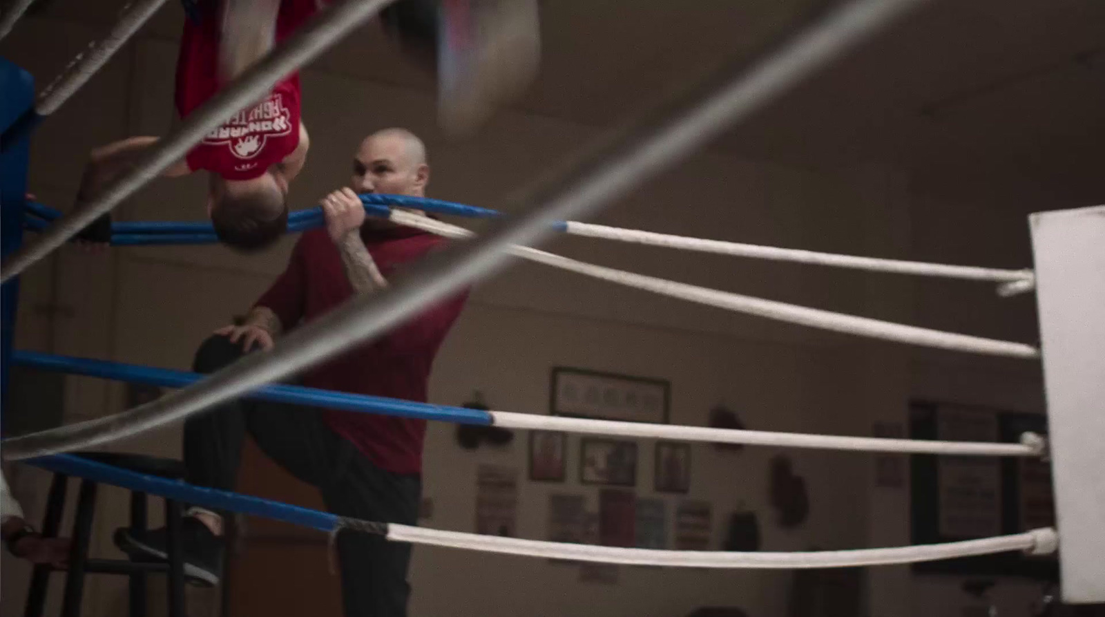 two men in a boxing ring with ropes