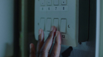 a person's hand on a light switch