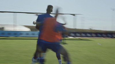 a couple of men playing a game of soccer