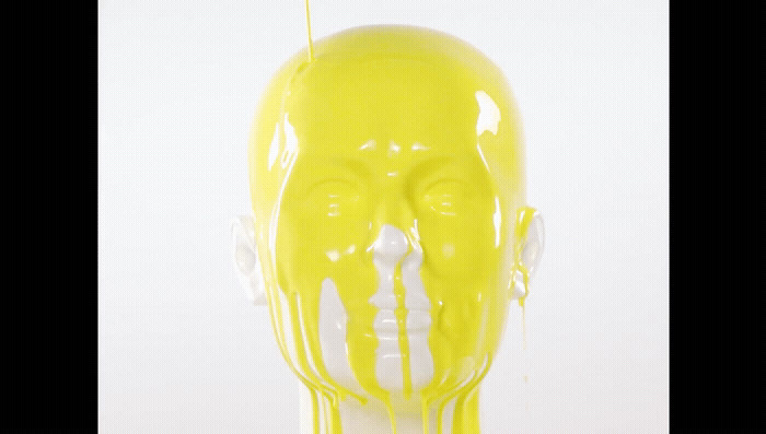 a plastic head with yellow paint on it