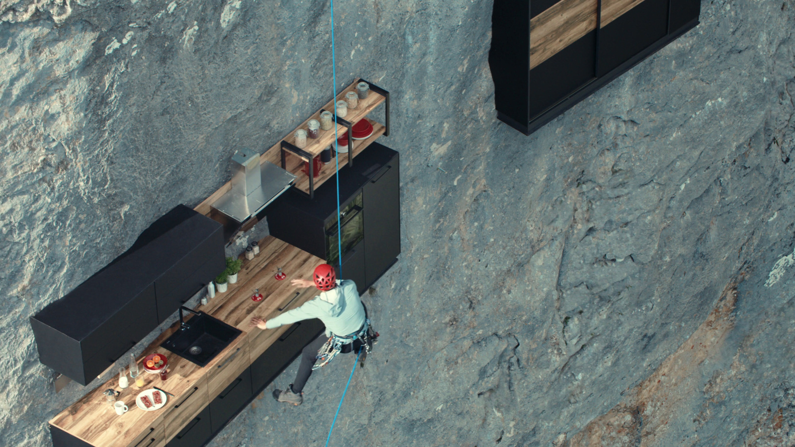 an aerial view of a kitchen and dining area