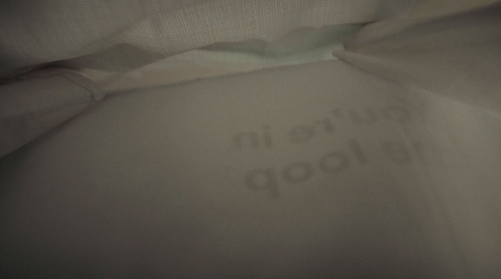 a close up of a white sheet with the words written on it