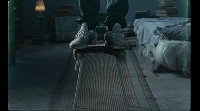 a person standing on top of a skateboard in a room