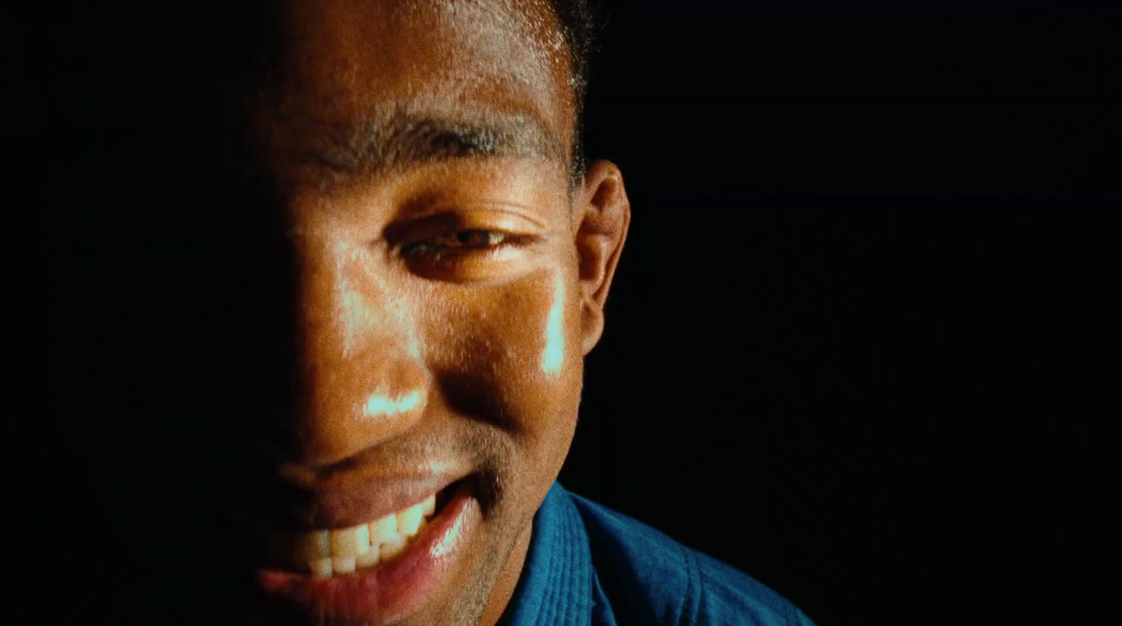 a close up of a person wearing a blue shirt