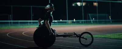 a person riding a bike on a track at night