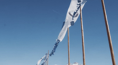 a couple of flags that are in the snow