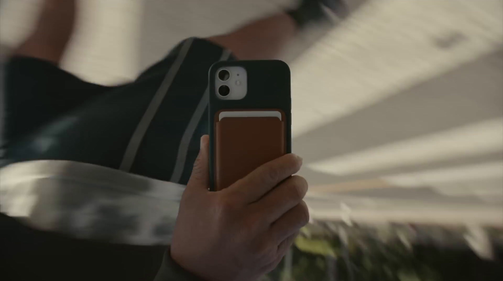 a person holding a cell phone in their hand