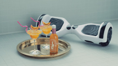 a hover with drinks on a tray next to it