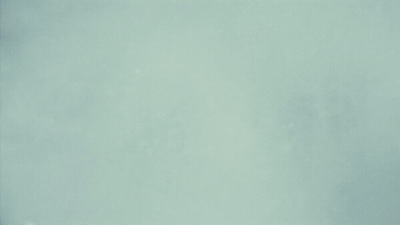 a group of people standing on top of a snow covered slope