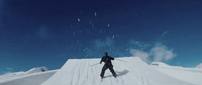 a man riding skis down the side of a snow covered slope