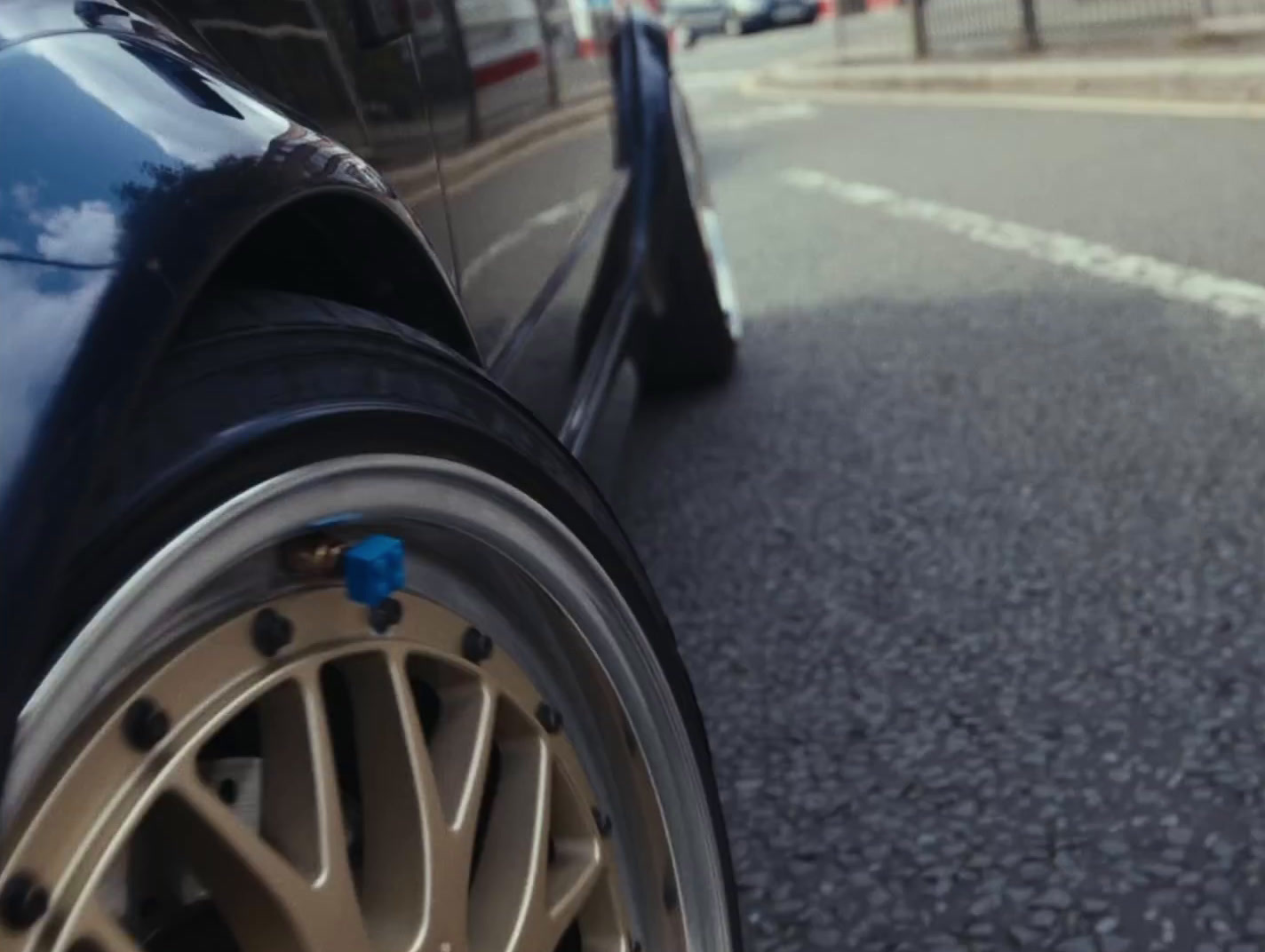 a close up of a car tire on a city street