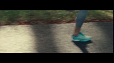 a person riding a skateboard down a street