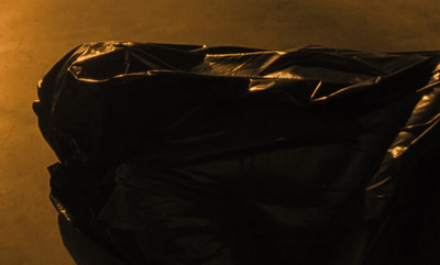 a black plastic bag sitting on top of a table