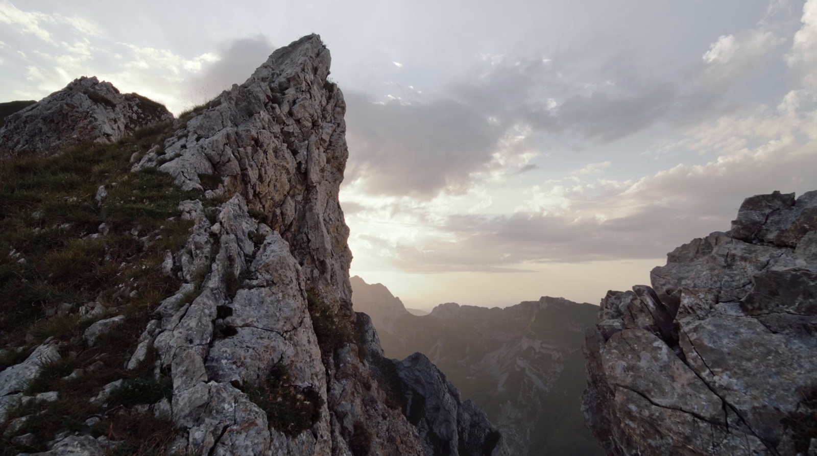 a view of a rocky outcropping with a cloudy sky