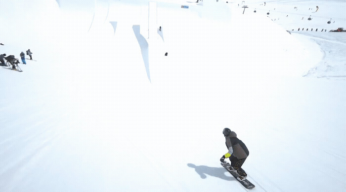 a man riding skis down a snow covered slope