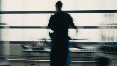 a blurry photo of a person standing in a room