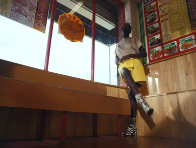 a man in yellow shorts and a yellow frisbee