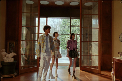 a group of people standing in front of a doorway