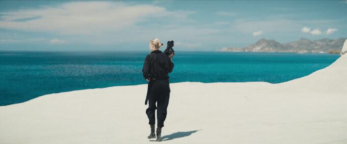 a person standing on top of a snow covered hill