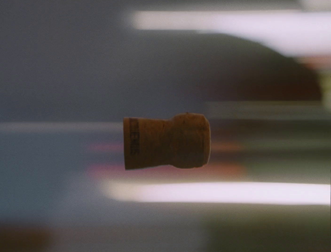 a blurry photo of a wine cork