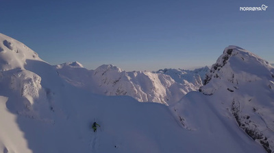 a person skiing down a snow covered mountain