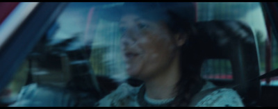 a woman sitting in the passenger seat of a car