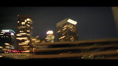 a view of a city at night from a moving vehicle