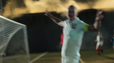 a blurry photo of a man on a tennis court