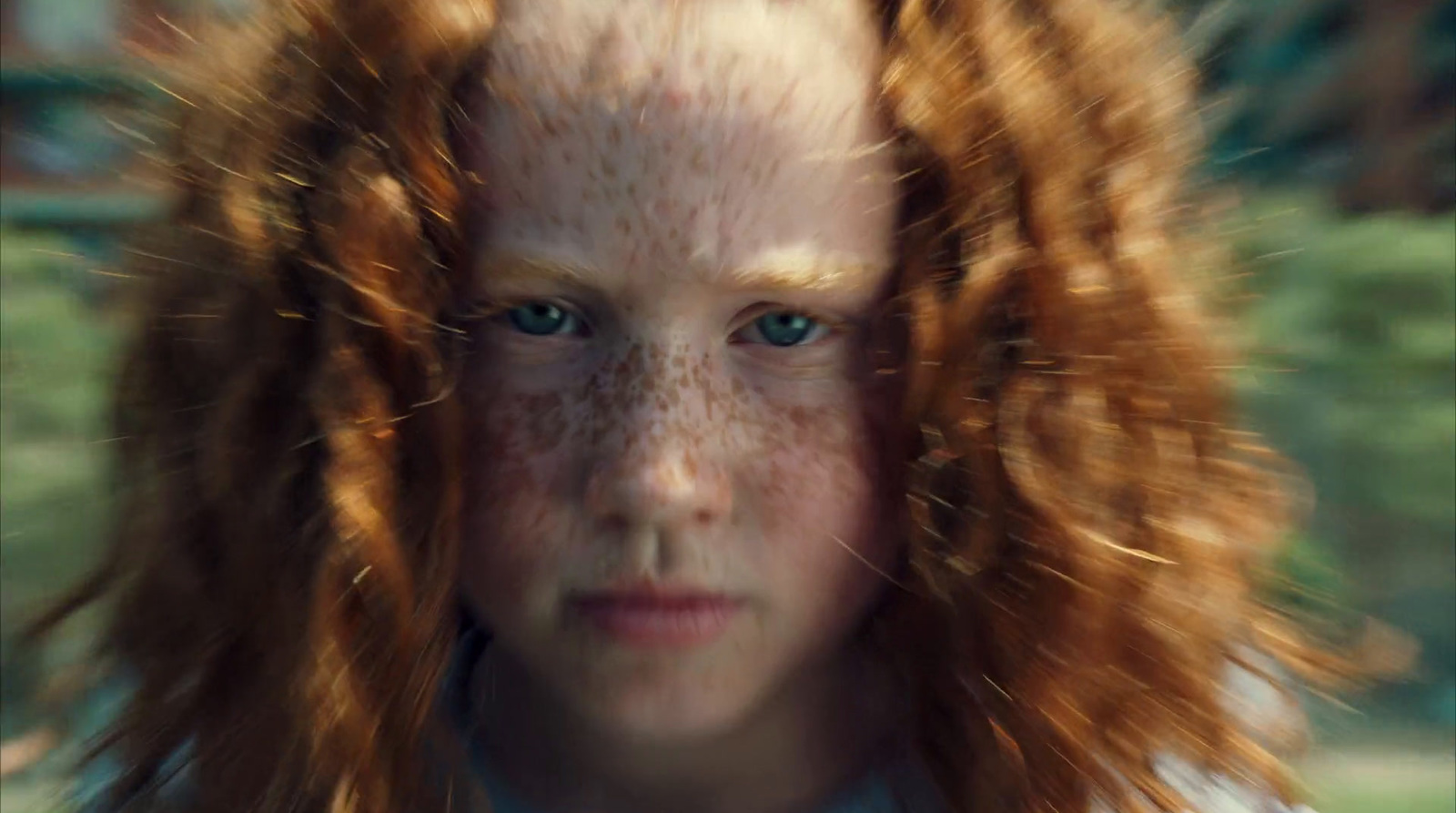 a young girl with freckles on her face and freckles on her