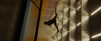 a person hanging upside down on a wall