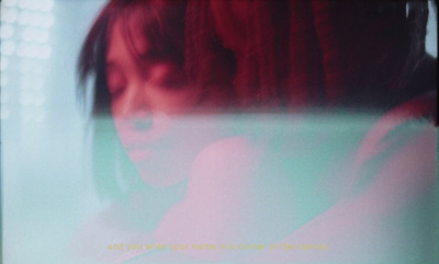 a blurry photo of a woman with red hair