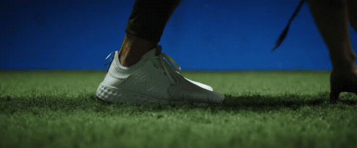 a close up of a person's feet in grass