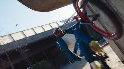 a man riding a skateboard down the side of a ramp