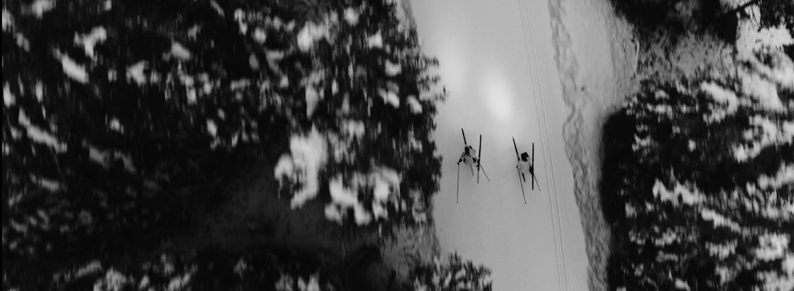 a black and white photo of a ski slope