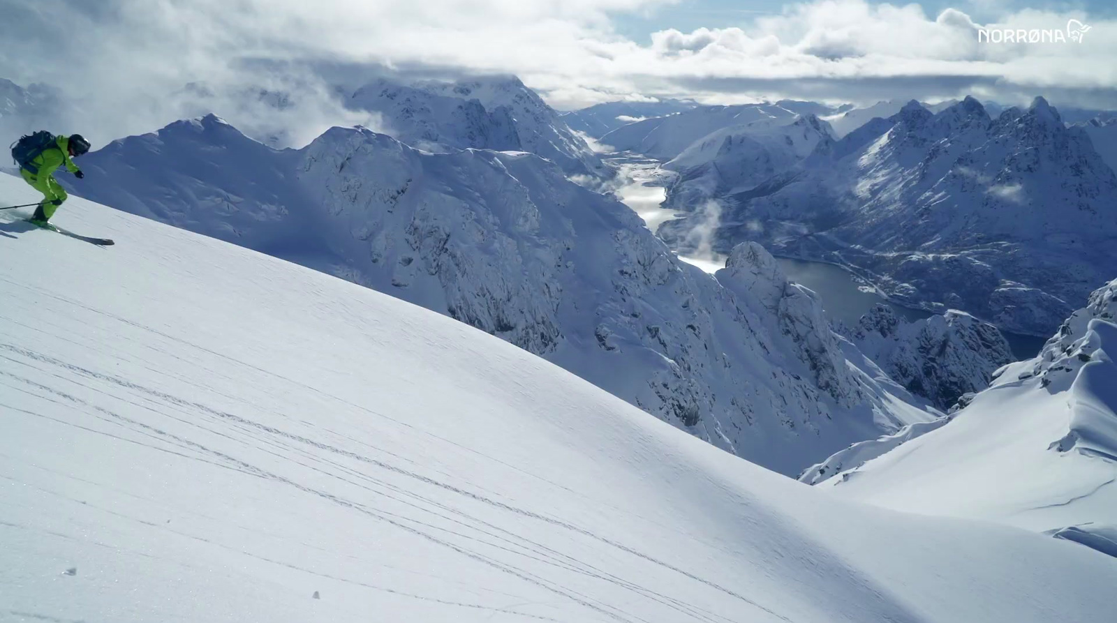 a person riding skis down a snow covered slope