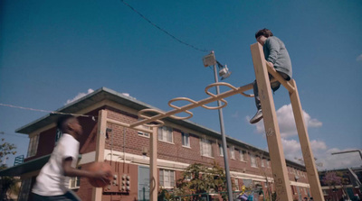 a man standing on top of a wooden structure