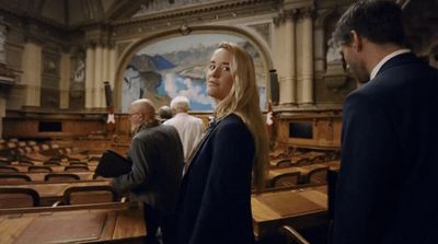 a group of people standing in a large room