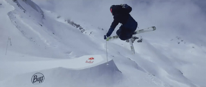 a man flying through the air while riding skis