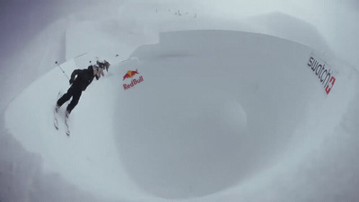 a man flying through the air while riding skis